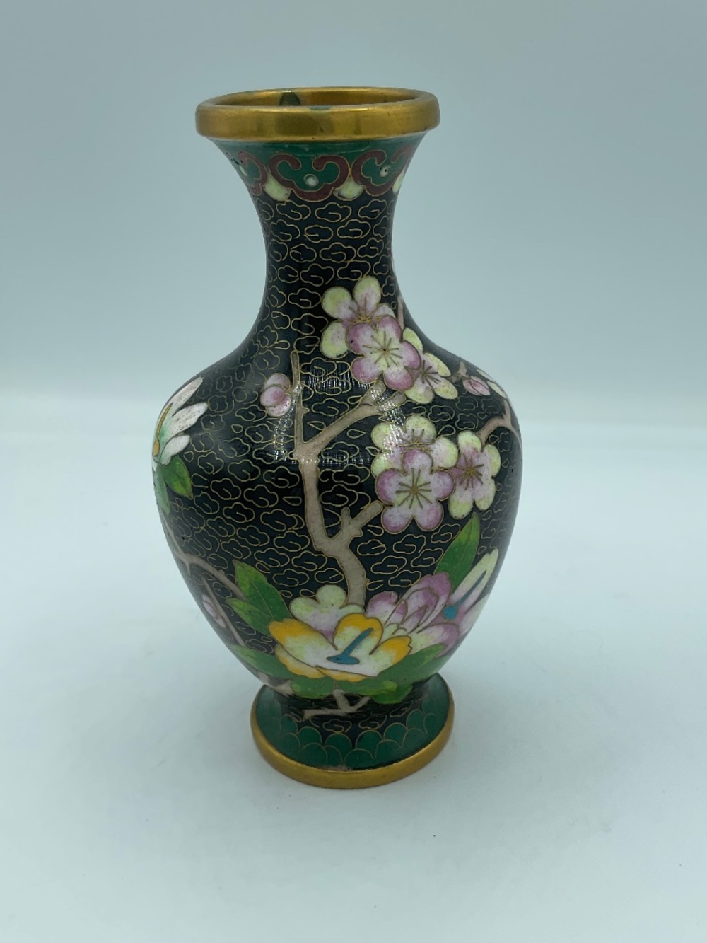 Chinese cloisonné enamel vase features a black background Floral Cherry Blossoms